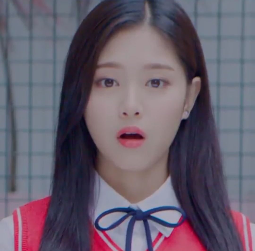 Hyunjin with her mouth open in surprise.